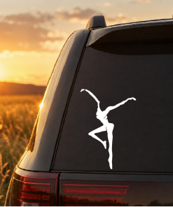 Rear window of an SUV with a light-blue dancer decal against a sunset backdrop.