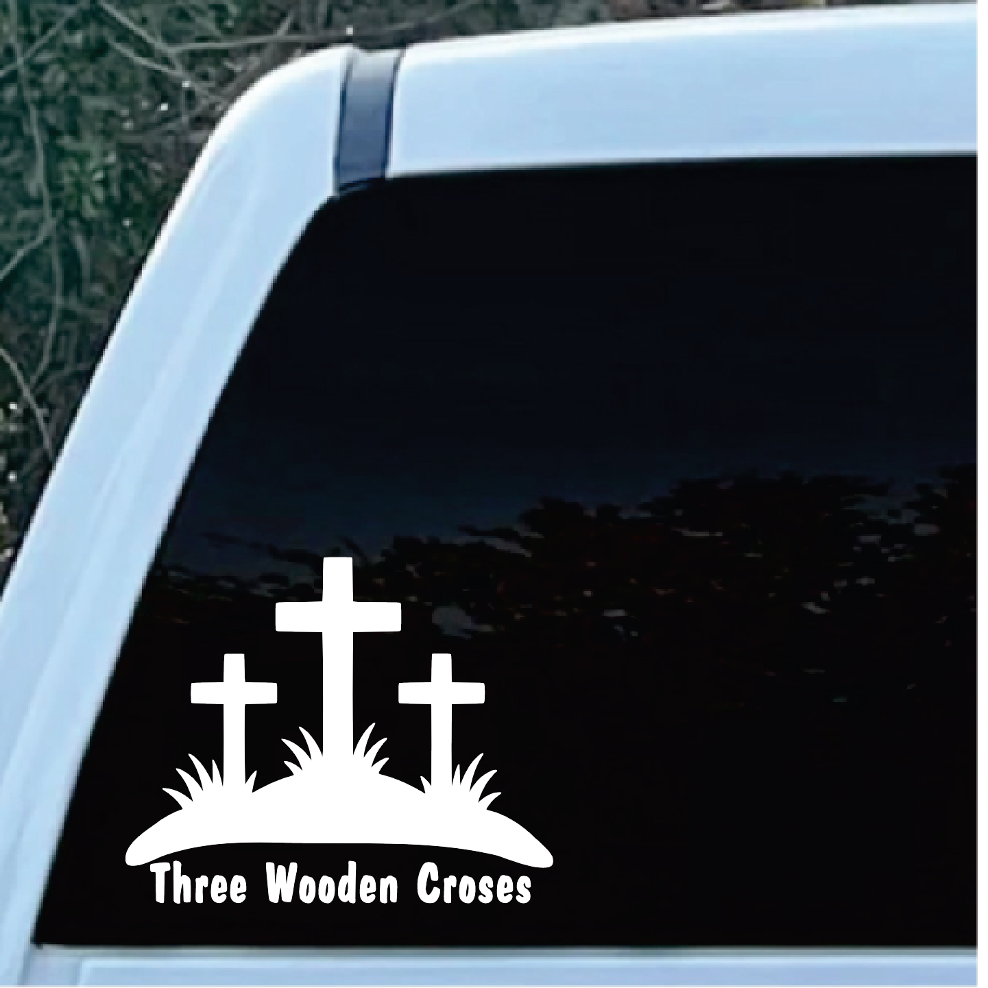 Three Wooden Crosses Window Decal Sticker | Custom Sticker Shop Logo of three white crosses on a hill with the text 'Three Wooden Crosses' beneath, displayed on a car window