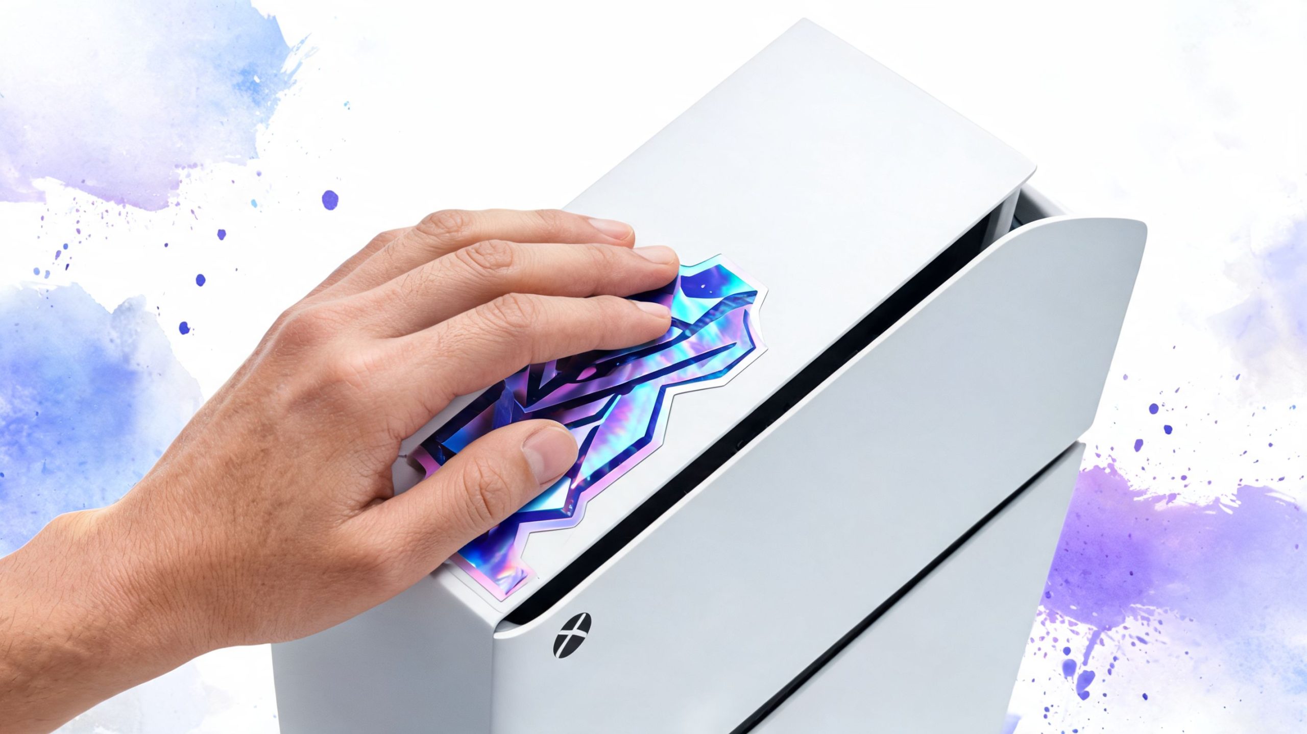A hand placing a holographic, iridescent sticker onto a sleek white Xbox game console.