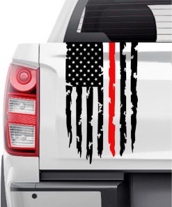 White pickup truck tailgate with a black-and-white American flag decal and a single vertical red stripe across the flag area (distressed/streaked design).