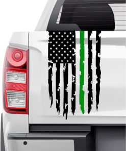 White pickup tailgate with a distressed US flag graphic and a vertical green stripe.